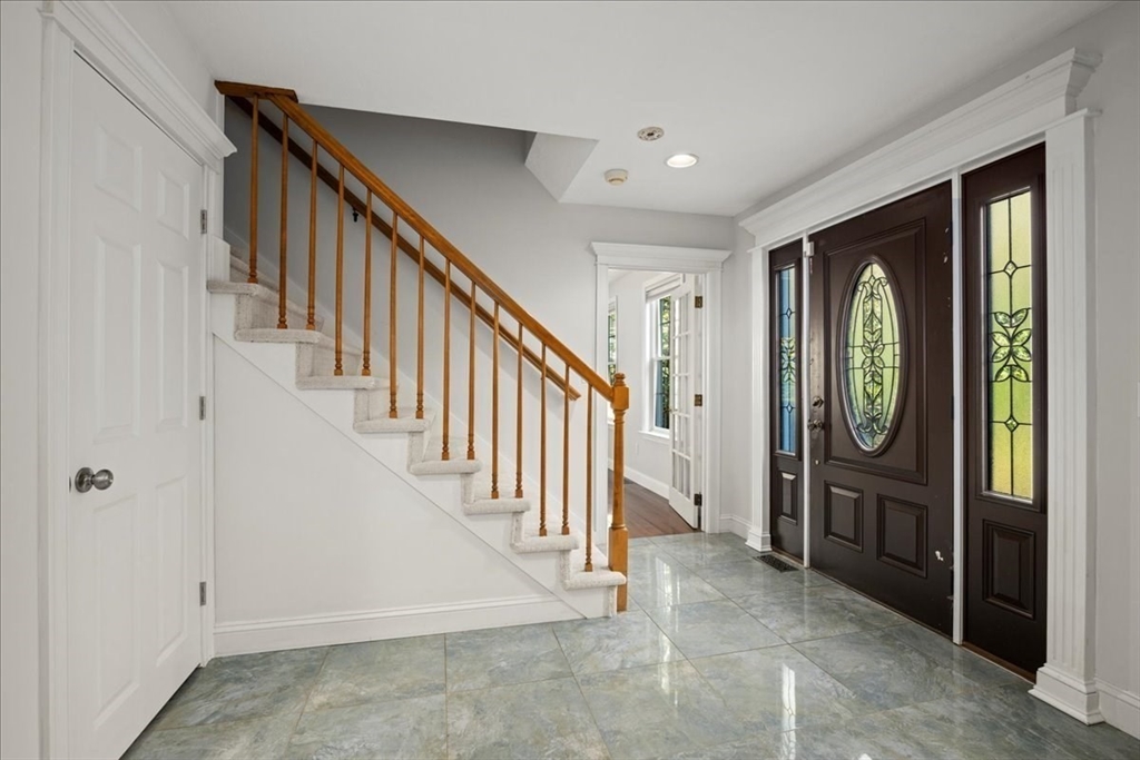 8 Arch Street Shrewsbury, MA 01545 - Photo 20 of 42 a view of an entryway with wooden floor and stairs