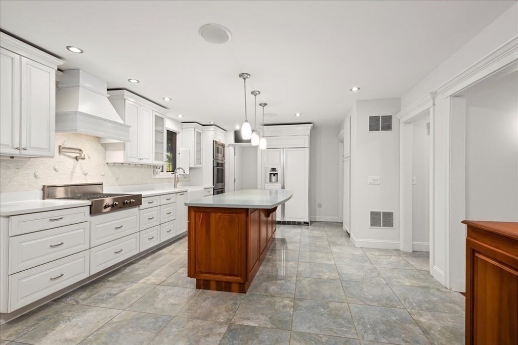8 Arch Street Shrewsbury, MA 01545 - Photo 2 of 42 a large kitchen with stainless steel appliances a cabinets and a counter top space