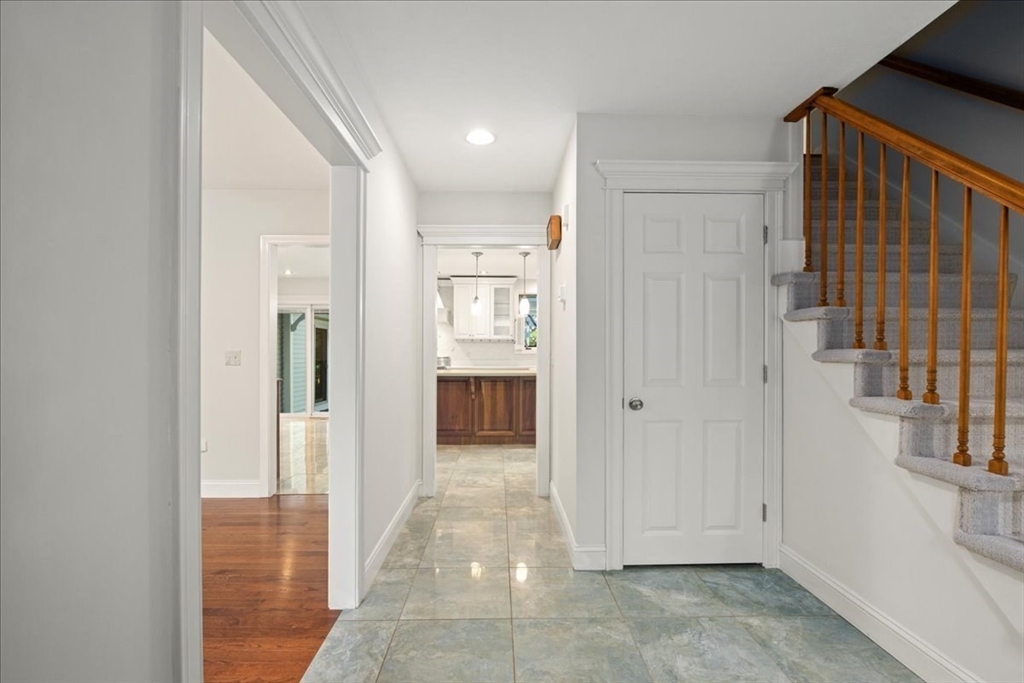 8 Arch Street Shrewsbury, MA 01545 - Photo 21 of 42 a view of a hallway with wooden shelves