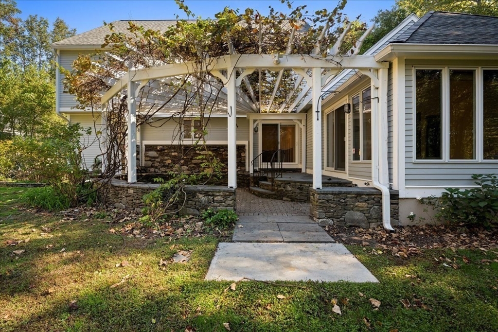 8 Arch Street Shrewsbury, MA 01545 - Photo 36 of 42 a view of a pathway with house entrance