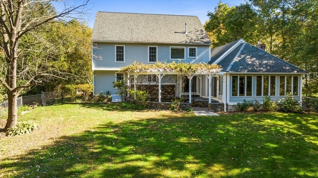 8 Arch Street Shrewsbury, MA 01545 - Photo 40 of 42 a front view of a house with yard and green space