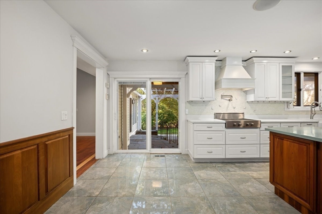 8 Arch Street Shrewsbury, MA 01545 - Photo 9 of 42 a large white kitchen with granite countertop cabinets and a sink
