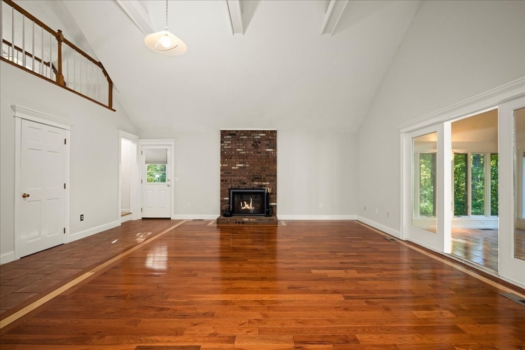 8 Arch Street Shrewsbury, MA 01545 - Photo 10 of 42 a view of an empty room with a window and wooden floor