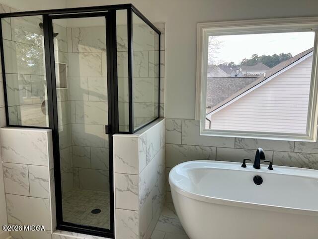 204 Trellis Walk Macon, GA 31220 - Photo 15 of 27 a bathroom with a bathtub and a shower