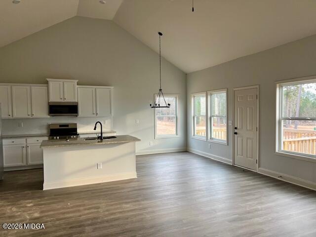 204 Trellis Walk Macon, GA 31220 - Photo 7 of 27 a kitchen with stainless steel appliances granite countertop a sink a stove a refrigerator and white cabinets