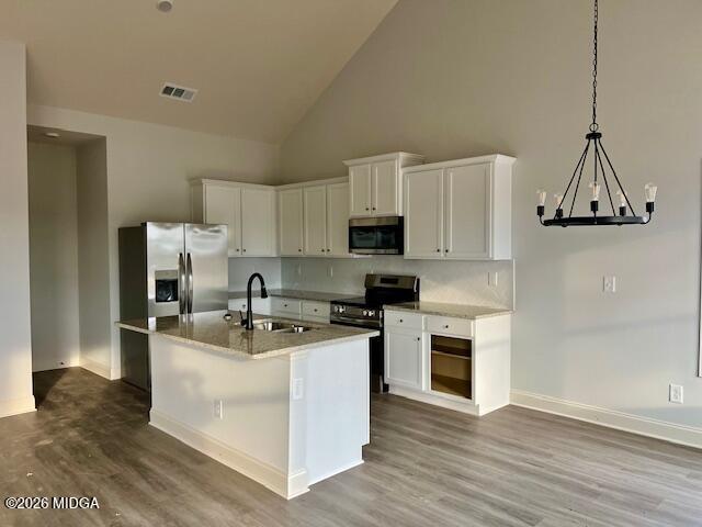 204 Trellis Walk Macon, GA 31220 - Photo 8 of 27 a kitchen with kitchen island a white counter top space cabinets and stainless steel appliances