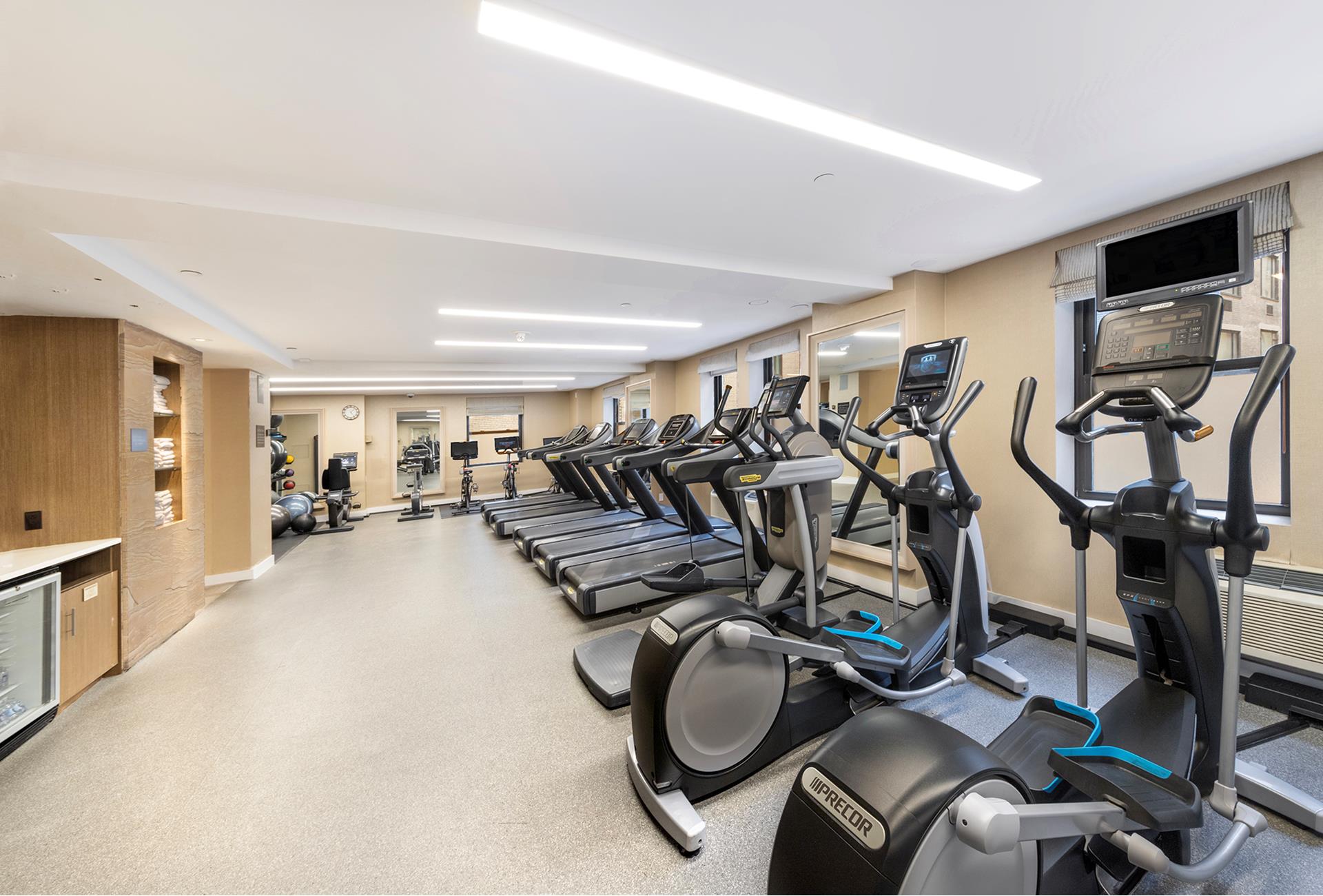 160 Central Park South, Unit 915 Manhattan, NY 10019 - Photo 16 of 18 a view of a room with gym equipment