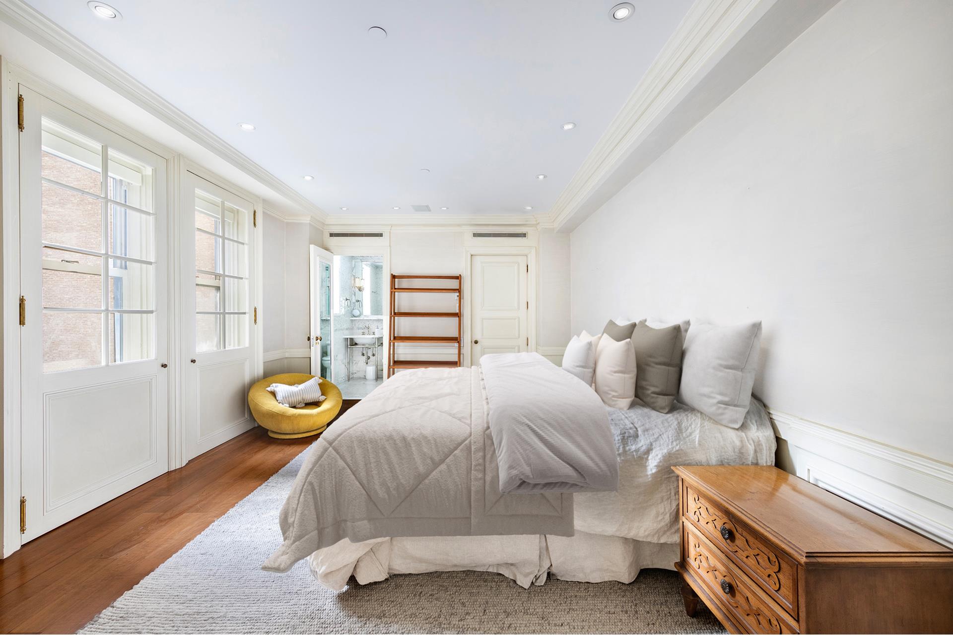 160 Central Park South, Unit 915 Manhattan, NY 10019 - Photo 6 of 18 a bedroom with bed and window