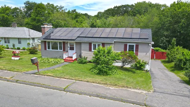 front view of a house with a yard