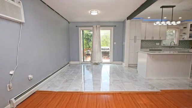 a view of a kitchen with granite countertop a living room