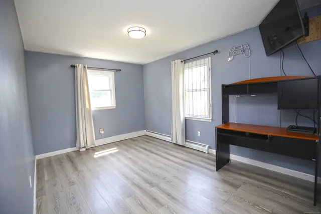 a view of livingroom with hardwood floor and a window
