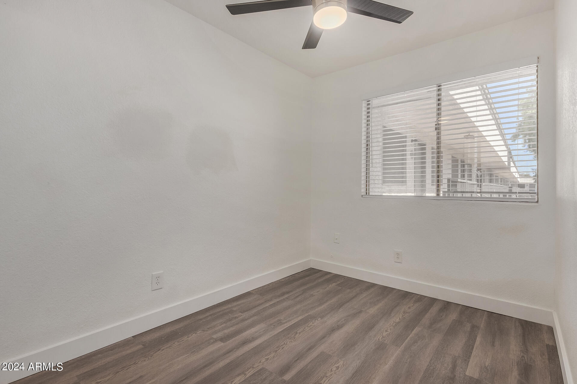18202 Cave Creek Road, Unit 251 Phoenix, AZ 85032 - Photo 13 of 20 an empty room with a window