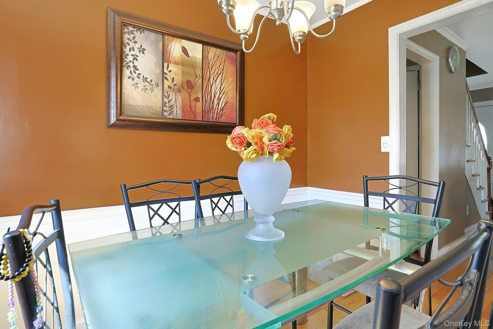 43 John Alden Road New Rochelle, NY 10801 - Photo 12 of 28 a view of a dining room with furniture and a chandelier