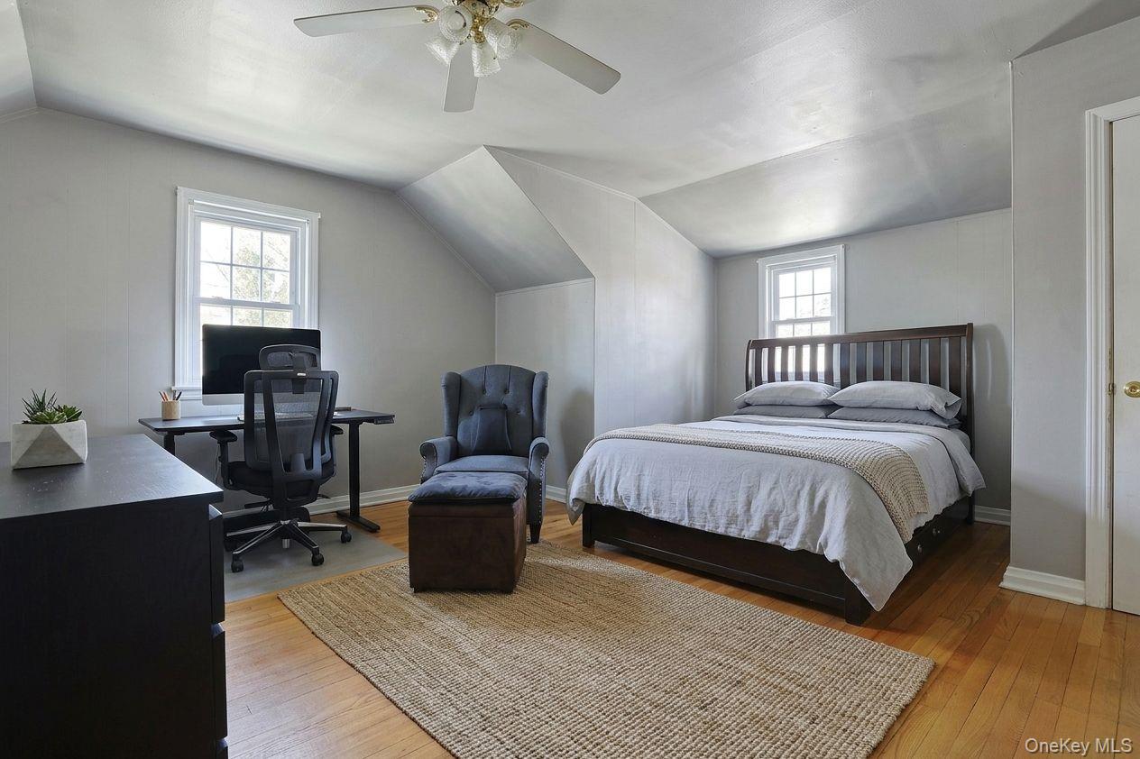 43 John Alden Road New Rochelle, NY 10801 - Photo 19 of 28 a bedroom with a bed and wooden floor