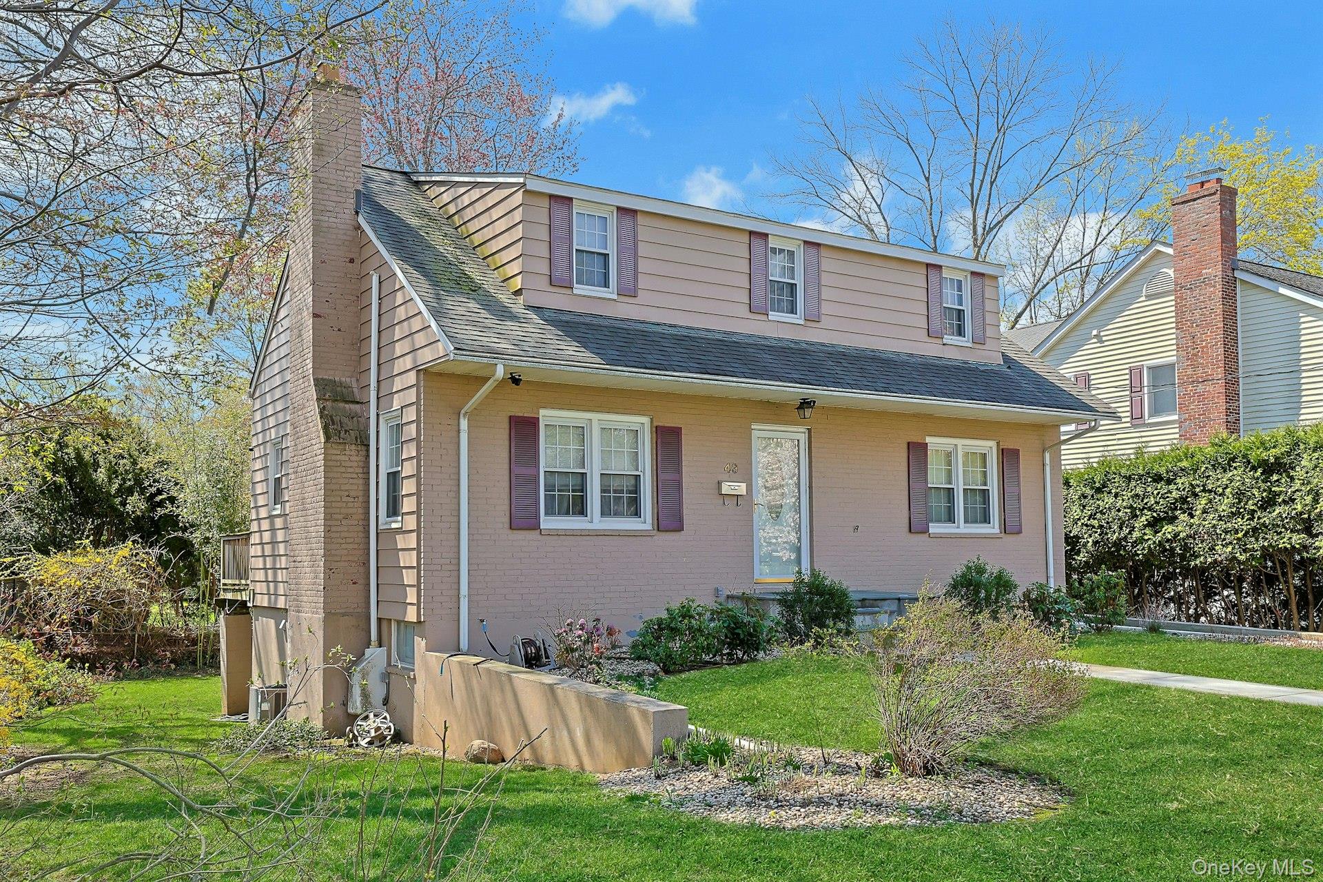 43 John Alden Road New Rochelle, NY 10801 - Photo 2 of 28 a front view of house with yard and green space