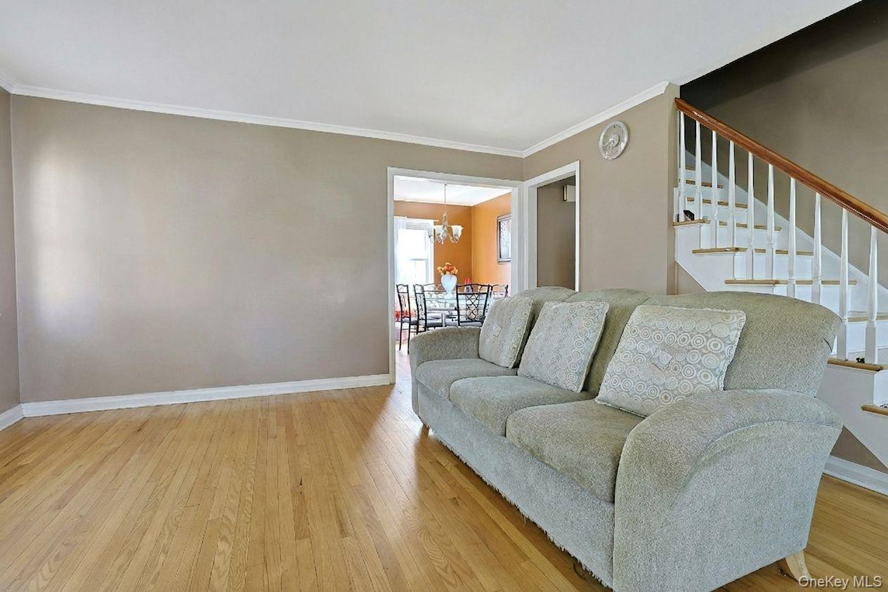 43 John Alden Road New Rochelle, NY 10801 - Photo 6 of 28 a living room with furniture and a wooden floor