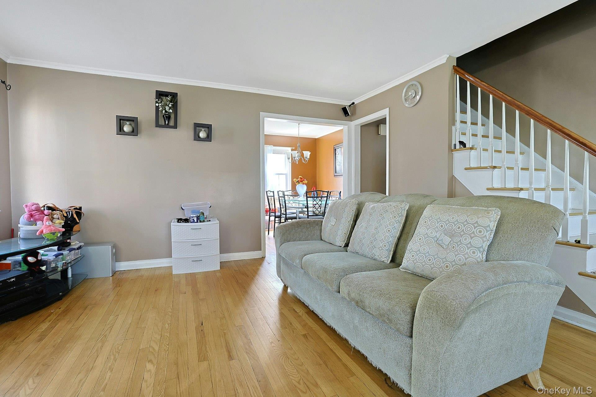 43 John Alden Road New Rochelle, NY 10801 - Photo 7 of 28 a living room with furniture and a wooden floor