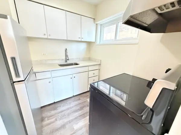 a view of kitchen with sink washer and dryer