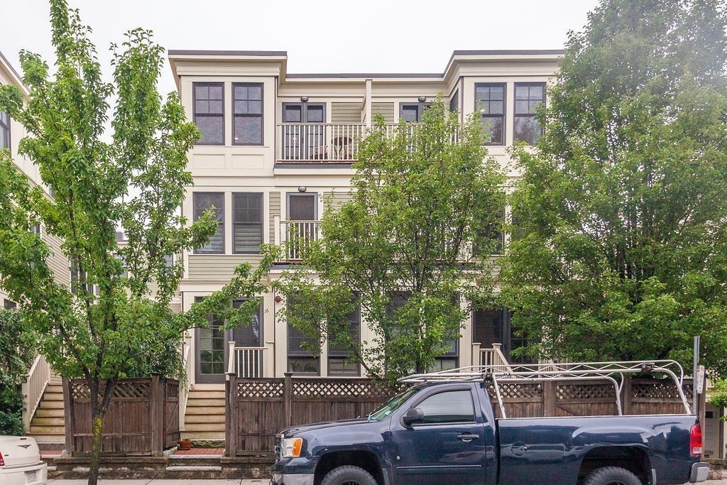 a view of a car parked in front of a building