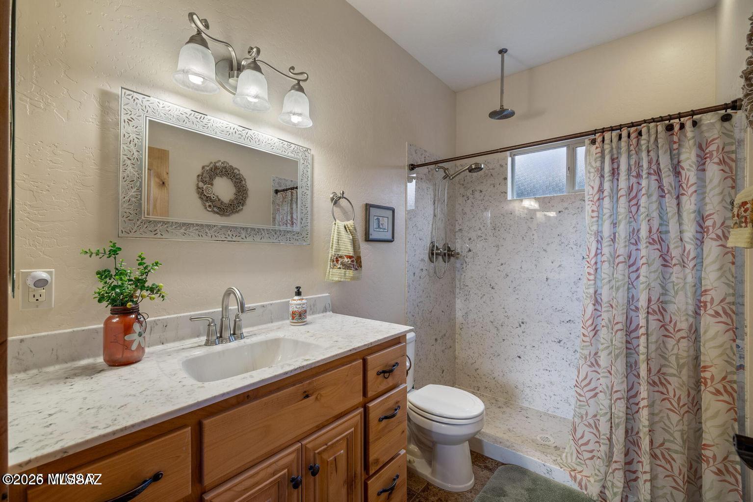17 2195 Alpine, AZ 85920 - Photo 14 of 48 a bathroom with a granite countertop sink a toilet and shower