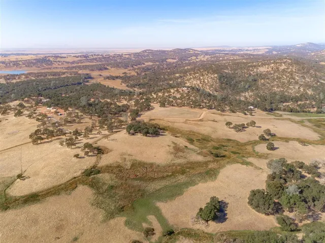 an aerial view of ocean with beach