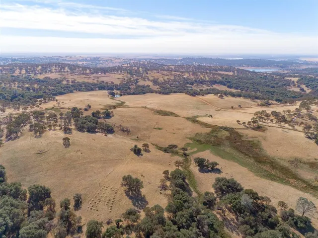 an aerial view of ocean with beach
