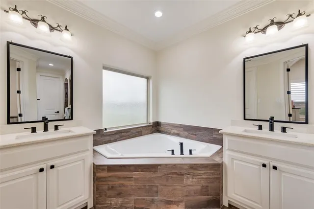 a bathroom with a bathtub and a sink