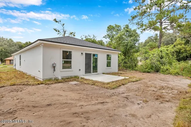 a view of backyard of a house