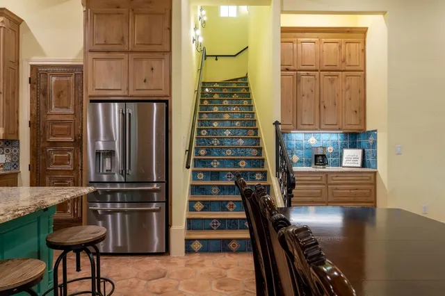 a view of kitchen with furniture and natural light
