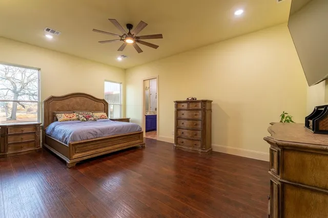 a bathroom with a double vanity sink mirror and shower