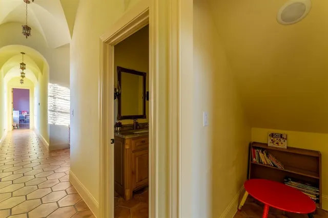 a kitchen with stainless steel appliances granite countertop a stove a microwave and a refrigerator