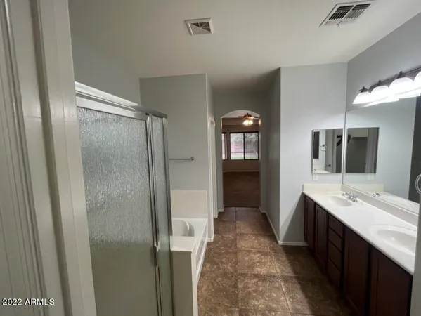 a white toilet sitting next to a small bathroom