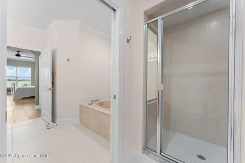 a bathroom with a bathtub and a shower