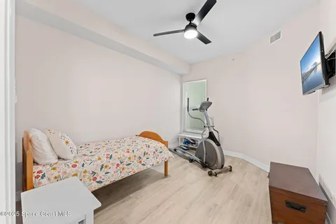 a view of a workspace with furniture and tv