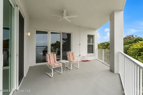 a chair and table in a balcony