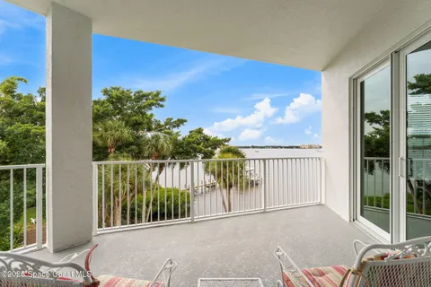 a view of balcony with furniture