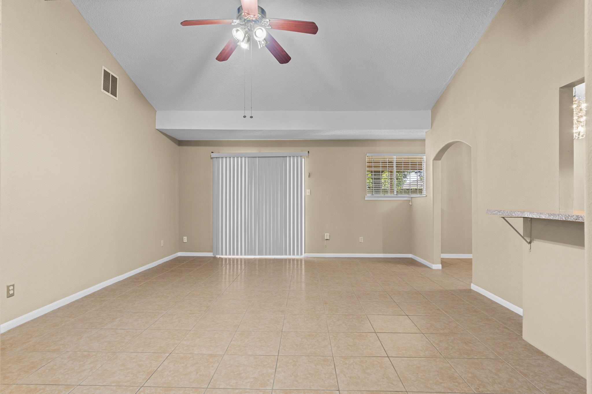 4114 Connorvale Road Houston, TX 77039 - Photo 18 of 41 an empty room with windows and fan