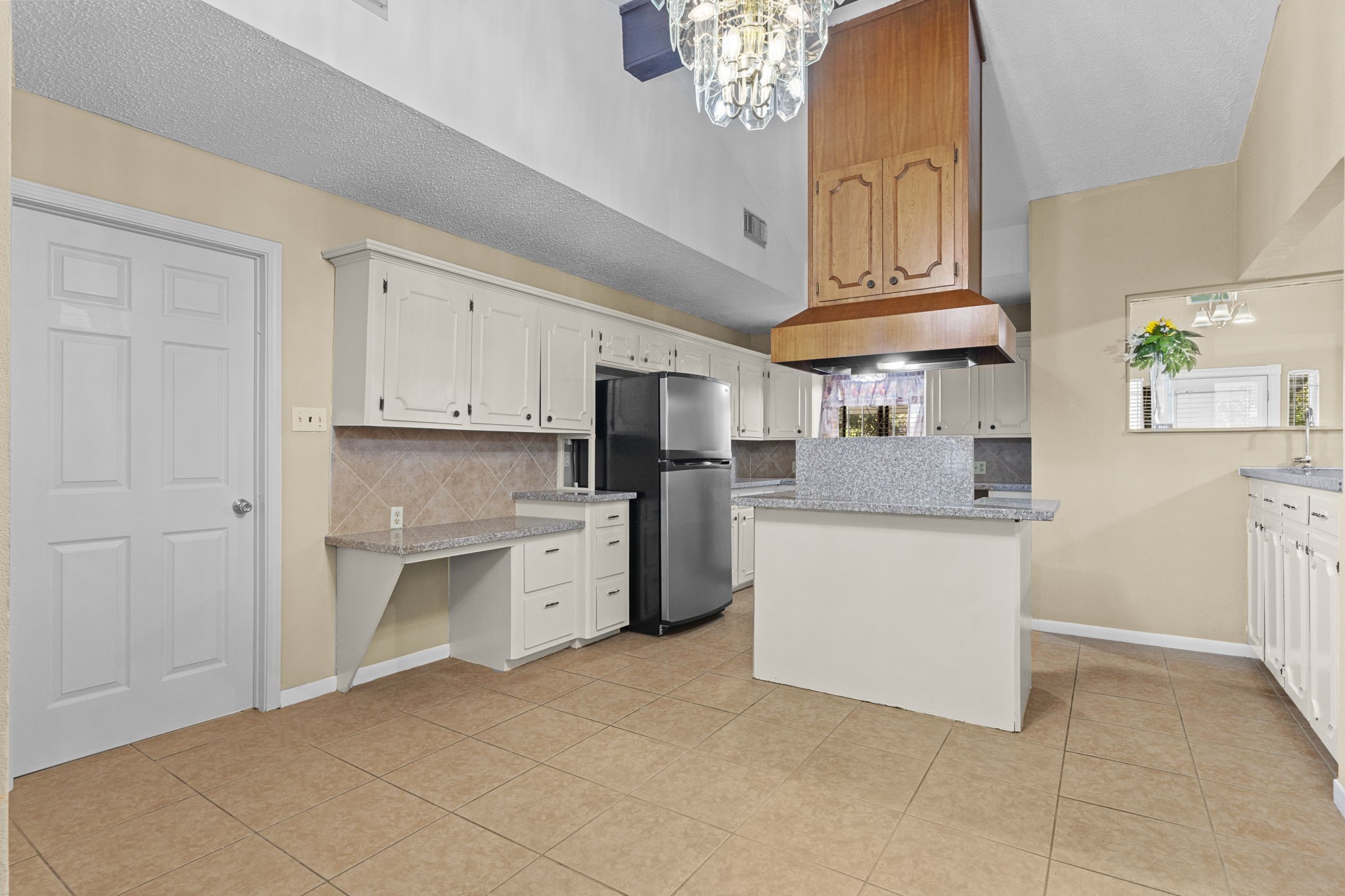 4114 Connorvale Road Houston, TX 77039 - Photo 22 of 41 a kitchen with cabinets and stainless steel appliances