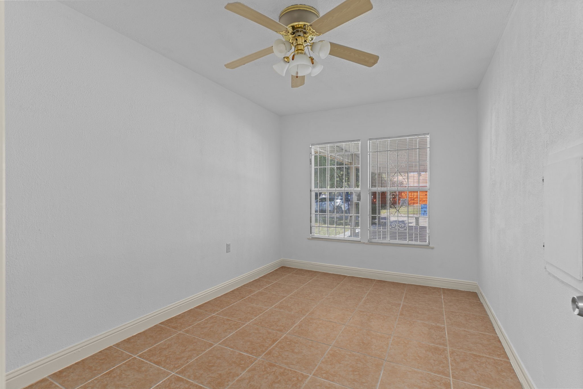 4114 Connorvale Road Houston, TX 77039 - Photo 26 of 41 an empty room with windows and fan