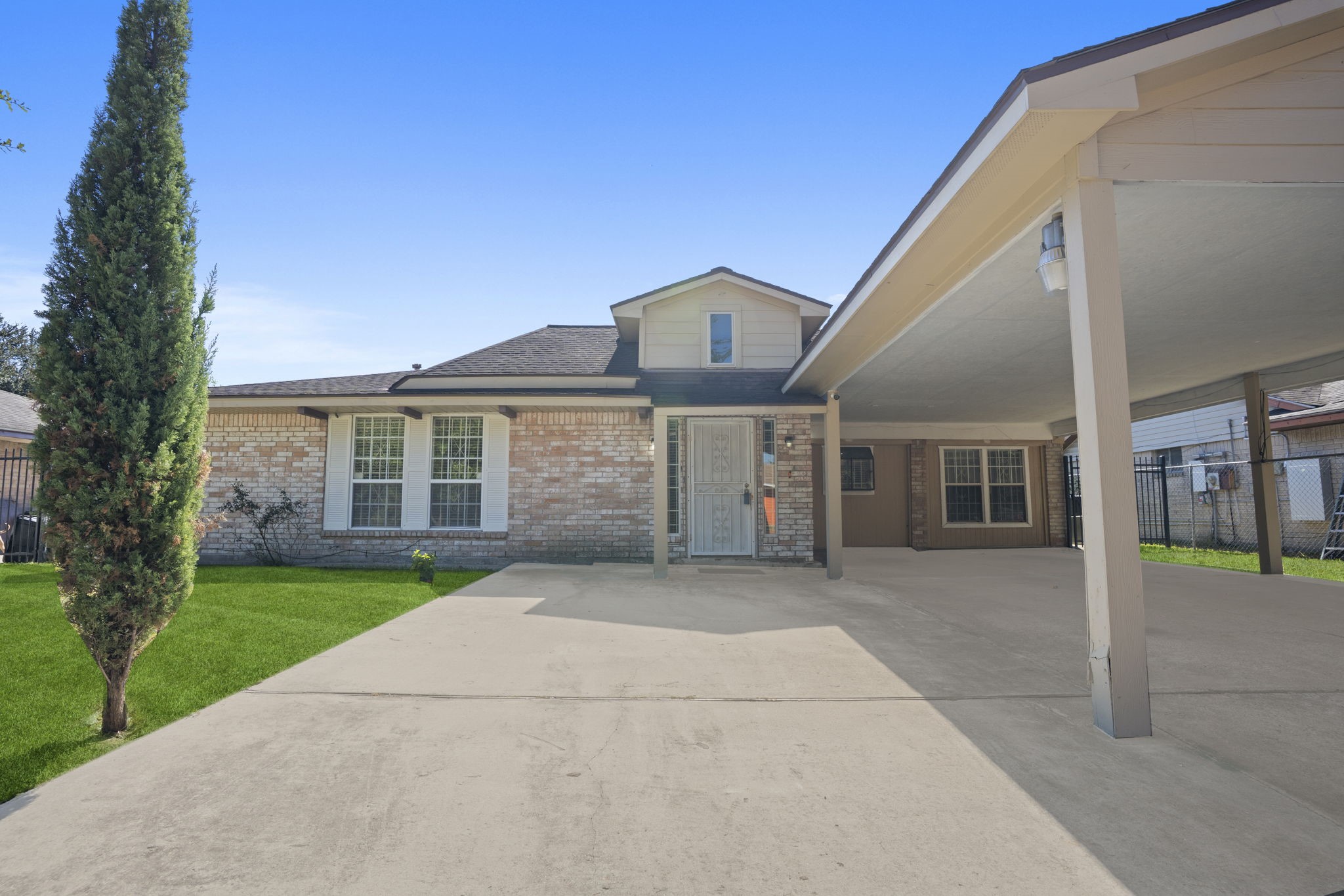 4114 Connorvale Road Houston, TX 77039 - Photo 3 of 41 a front view of a house with a yard and garage
