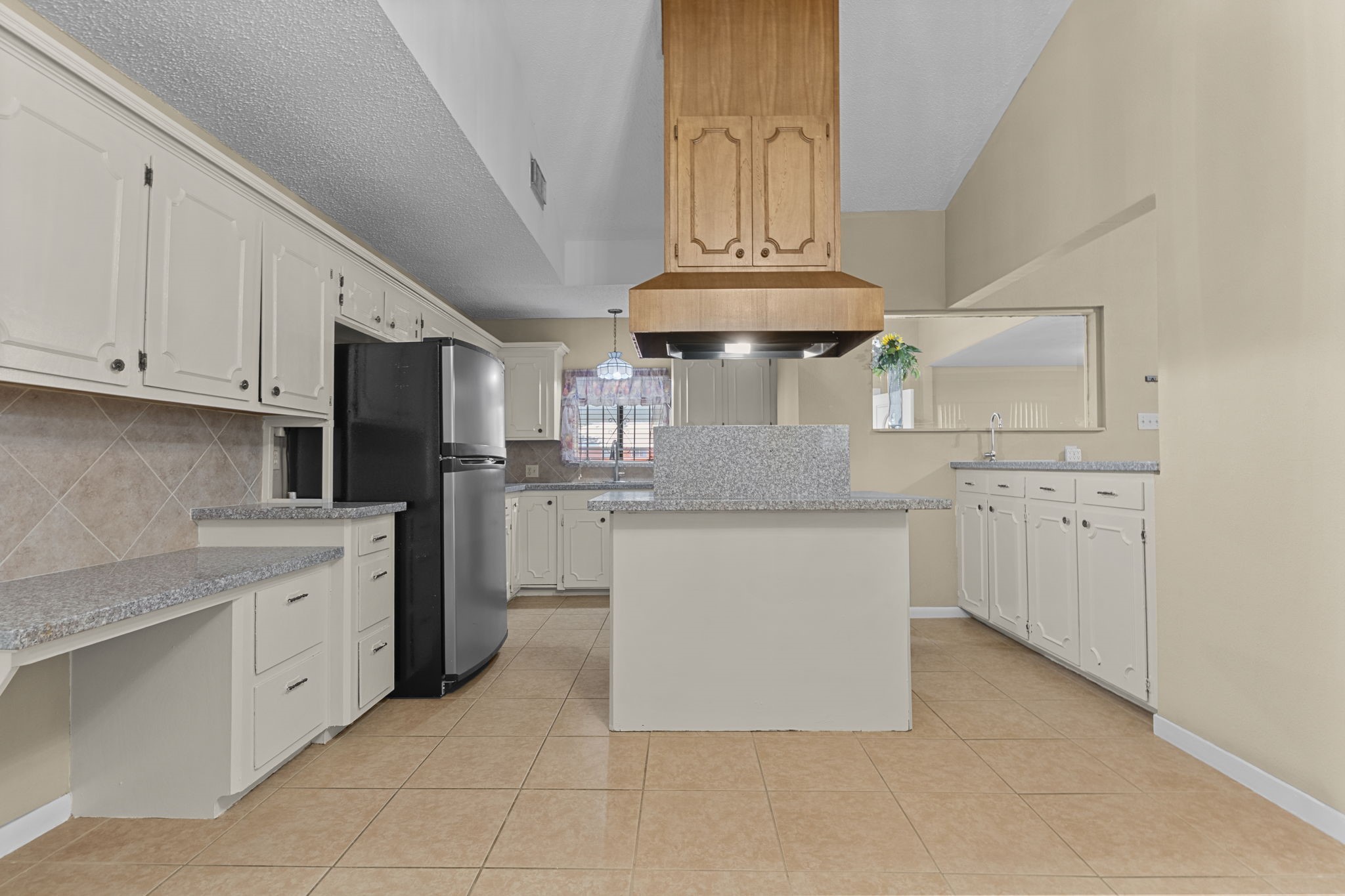 4114 Connorvale Road Houston, TX 77039 - Photo 33 of 41 a kitchen with stainless steel appliances a stove refrigerator and cabinets