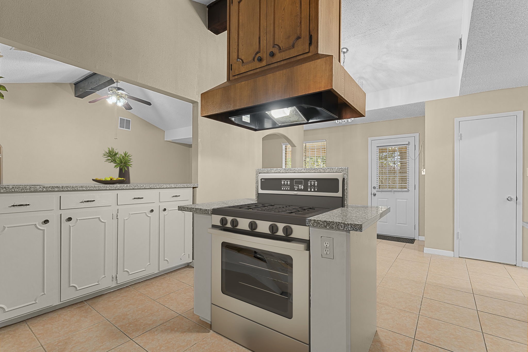 4114 Connorvale Road Houston, TX 77039 - Photo 7 of 41 a kitchen with granite countertop white cabinets and stainless steel appliances