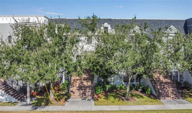 an aerial view of a house with a yard and garden