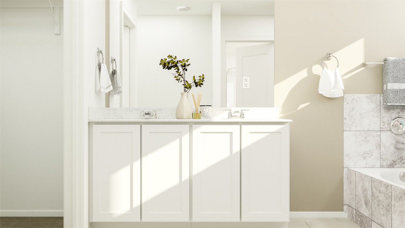 1412 Roaming Oak Bend Georgetown, TX 78628 - Photo 13 of 17 a bathroom with a bathtub and a sink