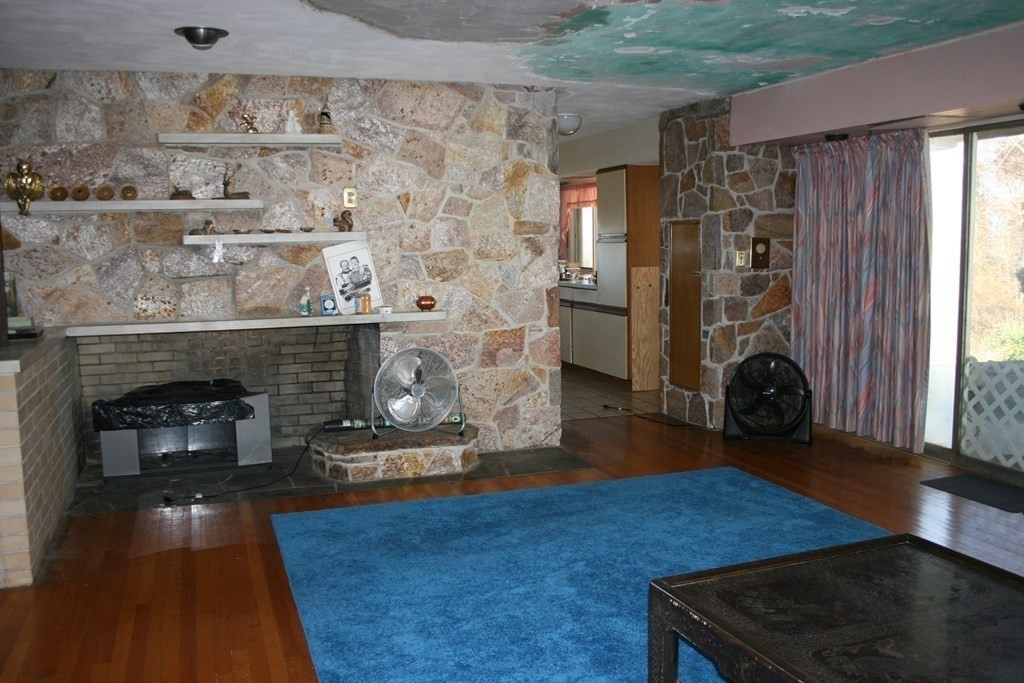 24 Sunset Rock Road Wilbraham, MA 01095 - Photo 4 of 18 a living room with furniture and a fireplace