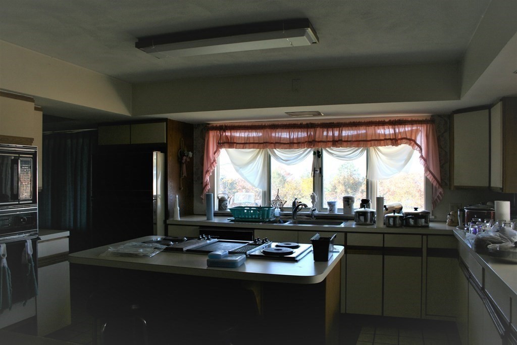 24 Sunset Rock Road Wilbraham, MA 01095 - Photo 5 of 18 a kitchen with a large counter top space
