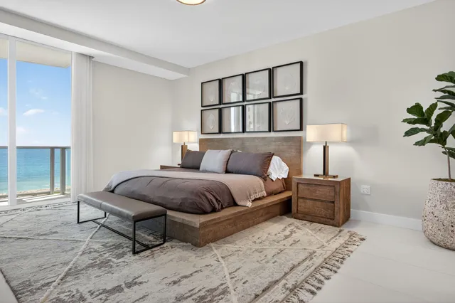 a bedroom with a large bed and a window