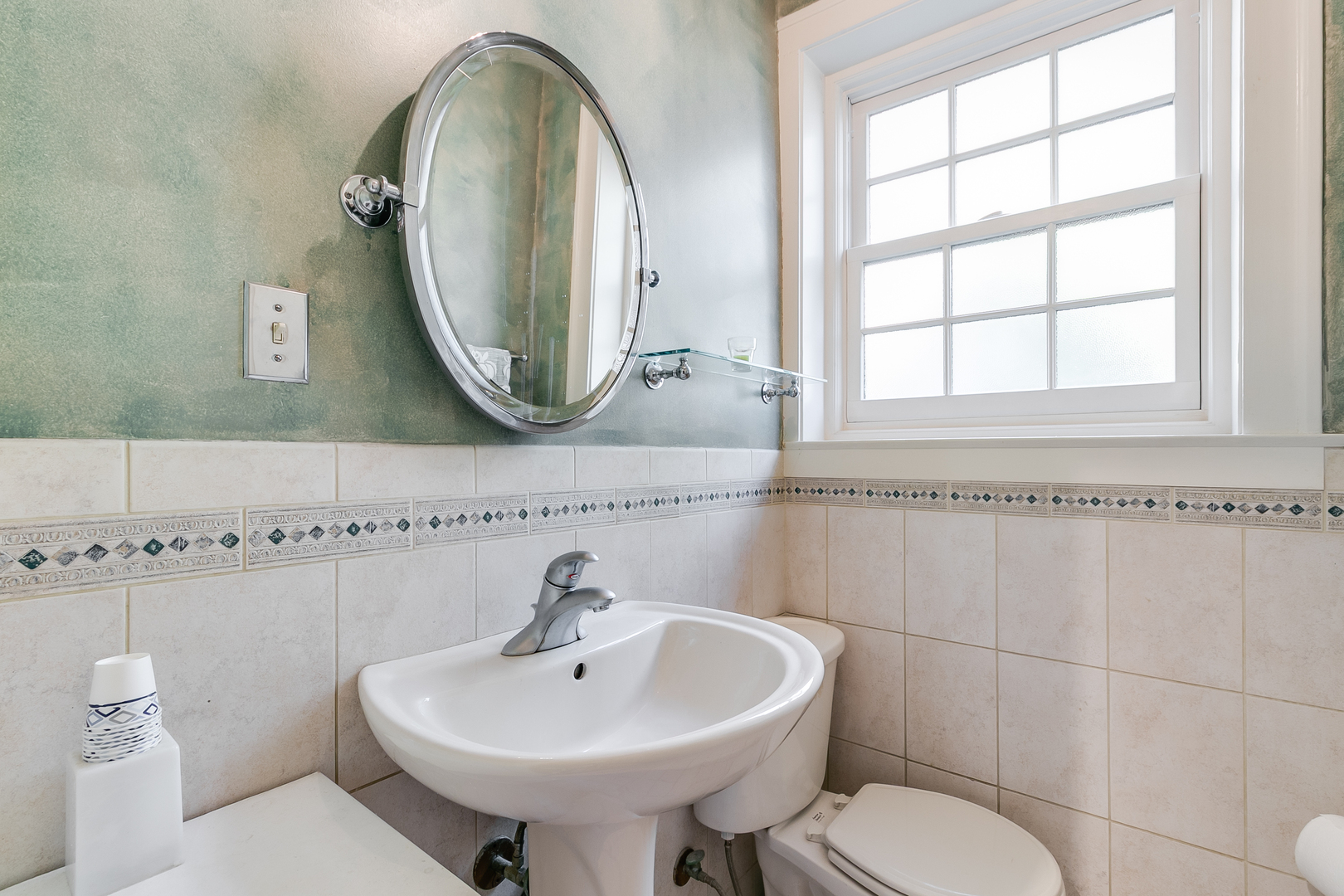 10337 South Hamilton Avenue Chicago, IL 60643 - Photo 10 of 27 a bathroom with a sink a toilet and a mirror