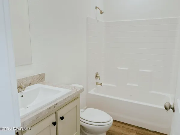 a bathroom with a sink a toilet and a bathtub