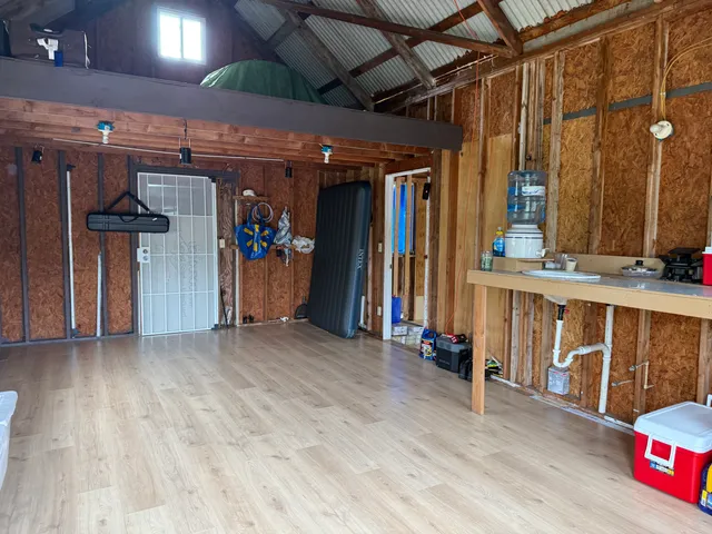 a view of a room with wooden walls
